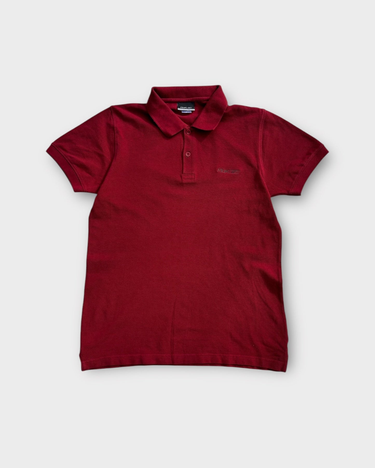 An image of a Reebok Red Poloshirt in size M.