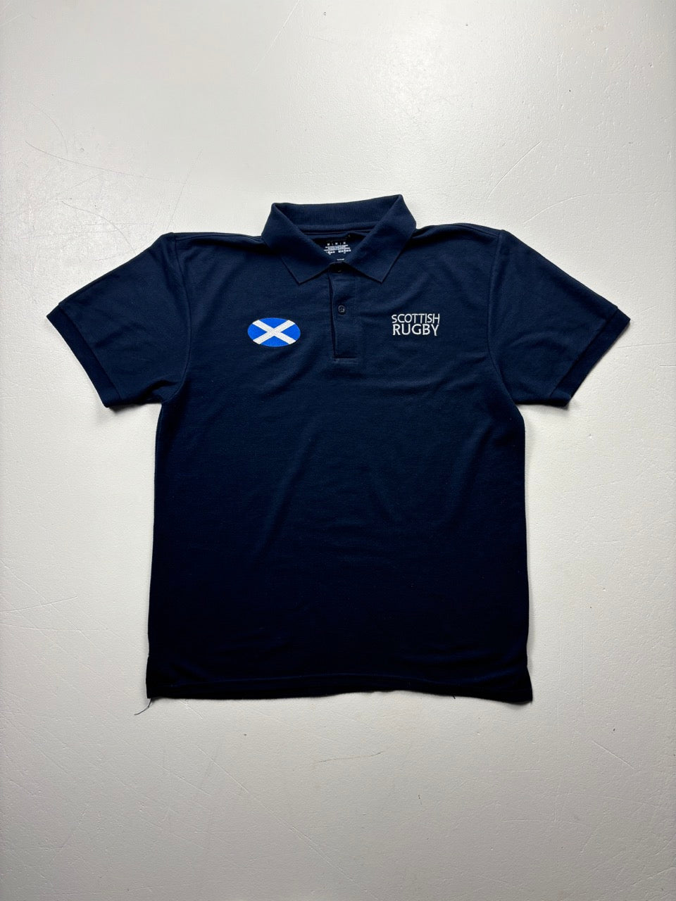An image of a Gildan Scottish Rugby Navy PoloShirt in size M.