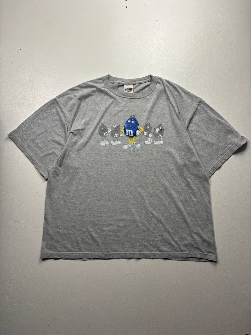 An image of a MandM Vintage Grey Graphic Tshirt in size 3XL.