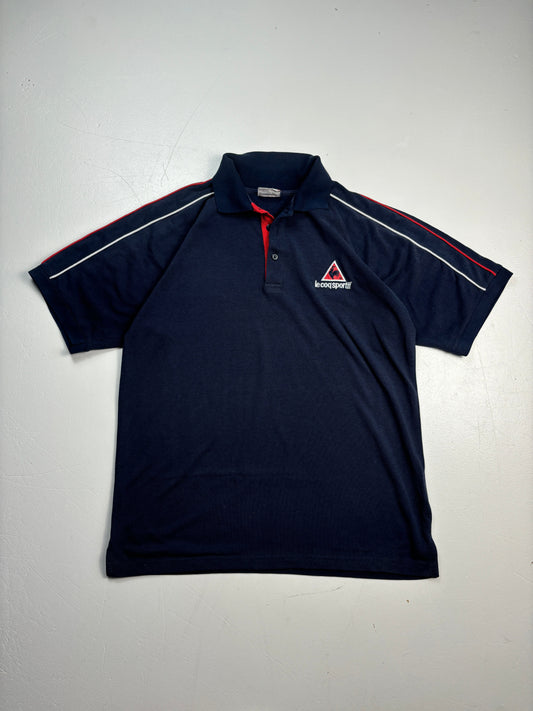 An image of a LeCoqSportif Navy PoloShirt in size S.