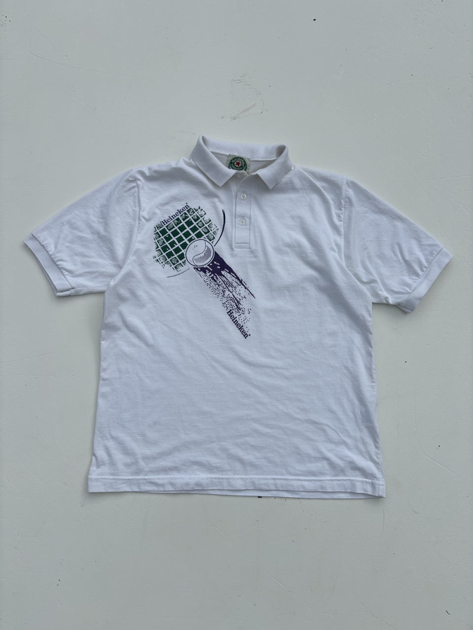 An image of a Heineken Graphic White PoloShirt in size L.